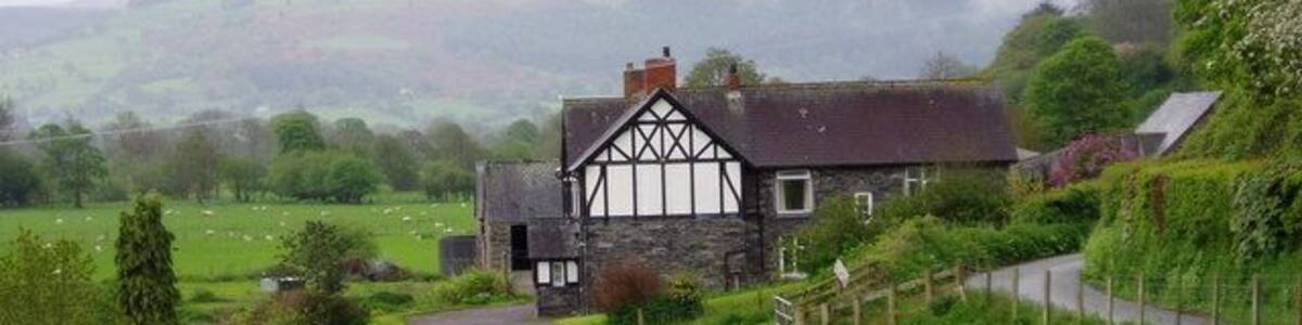 Gwnodl Bach. Old stone farmhouse on the Cynwyd to Llandderfel road, overlooking the Dee valley.