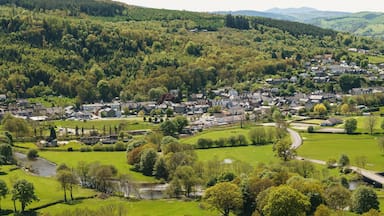 Panoramic aeriial landscape view of farms and hills above the town of Corwen North Wales