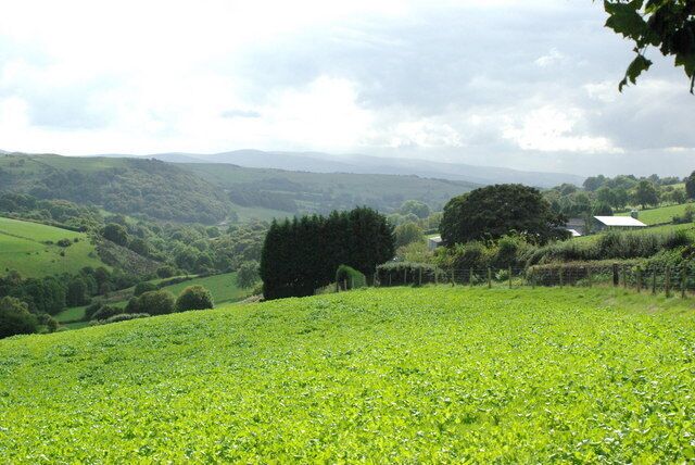 Valley of the upper Afon Clwyd View towards the Berwyn Mountains. The farm to the left is Pendre-bach. It is not named on the inset map, although Pendre-fawr lower down the road is named.