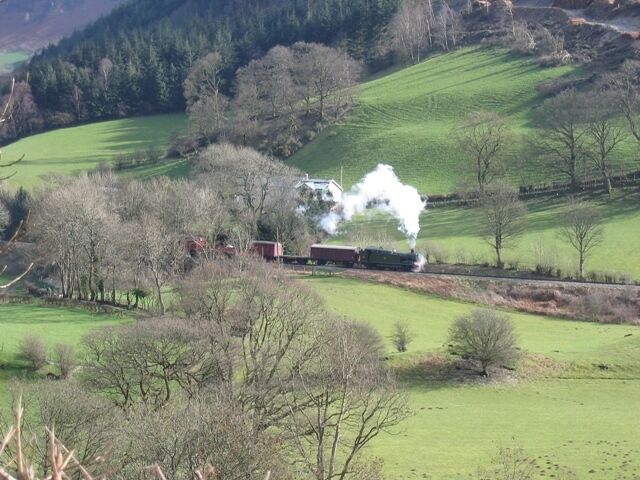 A Llangollen Railway Steam Locomotive in the River Dee Valley The locomotive from The Llangollen Railway kindly steamed into the square just in time for me take this photo. It stopped just past the house Garthydwr and is pictured reversing back down the line towards Llangollen. Although the house is in the next square, the locomotive and at least the first two wagons are past the hedge line west of the house, and therefore in this square. The River Dee is out of sight in the bottom of the valley below the camera. If anyone can identify the loco I will add the details to the photo.