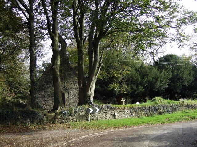 Treffgarne church Small Victorian-restoration church with yew-shaded path running through the churchyard and a stone stile at this, west, end.