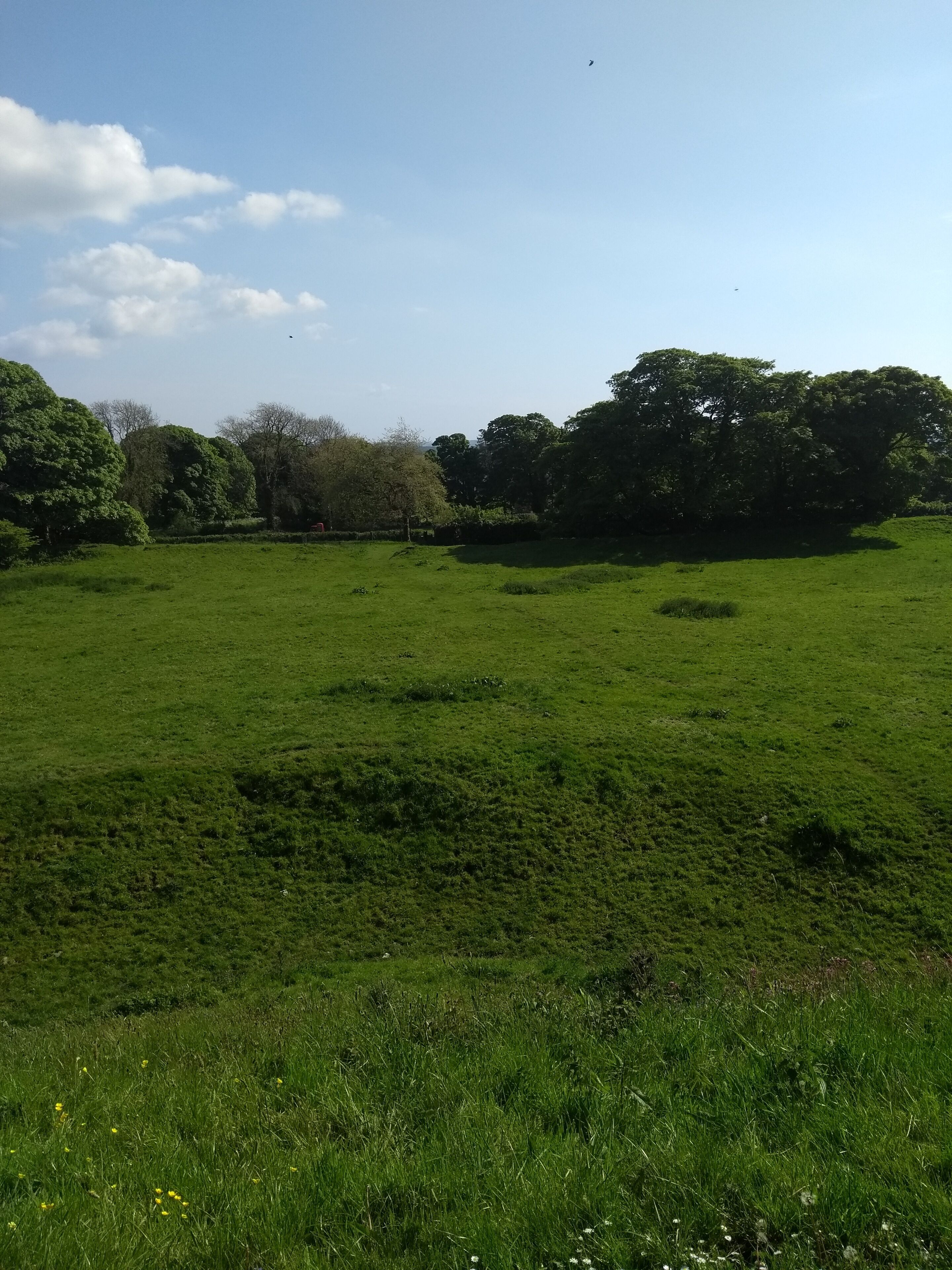 View from the Motte of Wiston Castle, showing the surrounding earthworks.