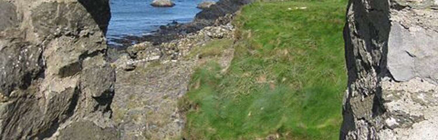 Through the rectangular window. A view of the rocky coastline at Aber Draw through the window of the ruined watermill. See also 1518296