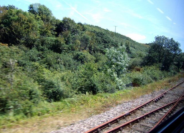 Old branch line to Trecwn On the southern edge of the gridsquare the disused railway line to Trecwn diverges from the main Fishguard branch line. This track served the RNAD establishment at Trecwn which has been closed for a number of years, but the line appears to be in reasonable condition and has the potential to be re-opened. Photograph taken from train travelling north towards Fishguard.
