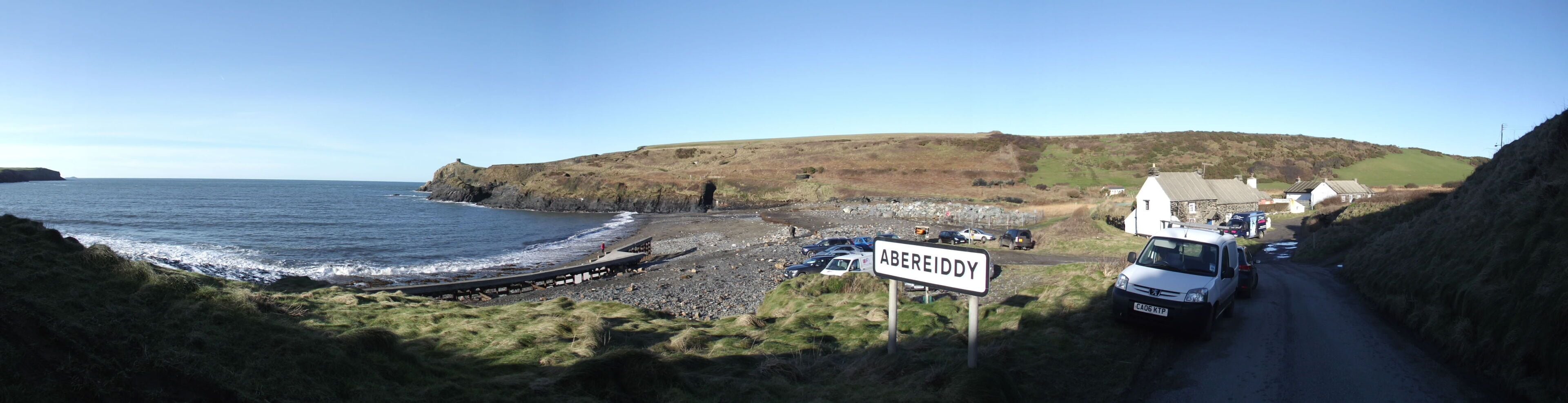 Winter storms and high tides have taken their toll on Abereiddy beach carpark. Panorama of the carpark and beach.