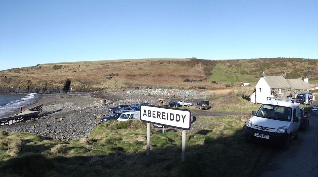 Winter storms and high tides have taken their toll on Abereiddy beach carpark. Panorama of the carpark and beach.