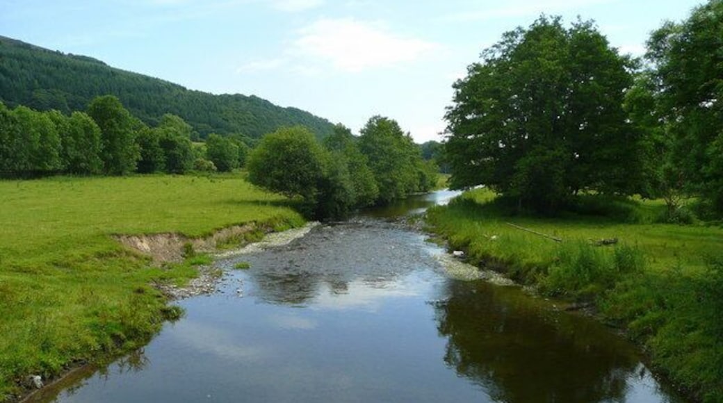 River Teme - summer View downstream from Stowe Bridge. Tornett Wood is on the steep valley side to the left in Shropshire.