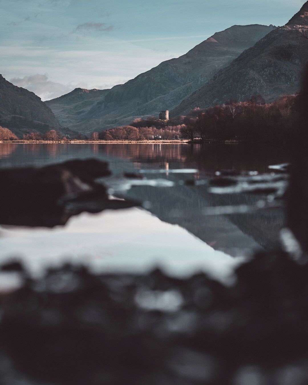 This is one of the most photographed scenes in the UK... 10ft to my right stands "The Lone Tree" of Padarn Lake, Llanberis - however I already had that "iconic" shot, so I started looking elsewhere.
I like to limit myself to prime lenses - it focuses me more on composition, moving myself for the shot rather than relying on the convenience of a zoom range.
#snowdonia #snowdoniagram #thewalescollective #bvs100k #perspectives #snowdoniapics #llynpadarn #castelldolbadarn #dolbadarncastle #llanberis #padarn #reflection #pmwintergridchallenge #instagood10k #northwales #visitwales #discoverwales #findyourepic #85mm #85mmlandscape #vintagelens