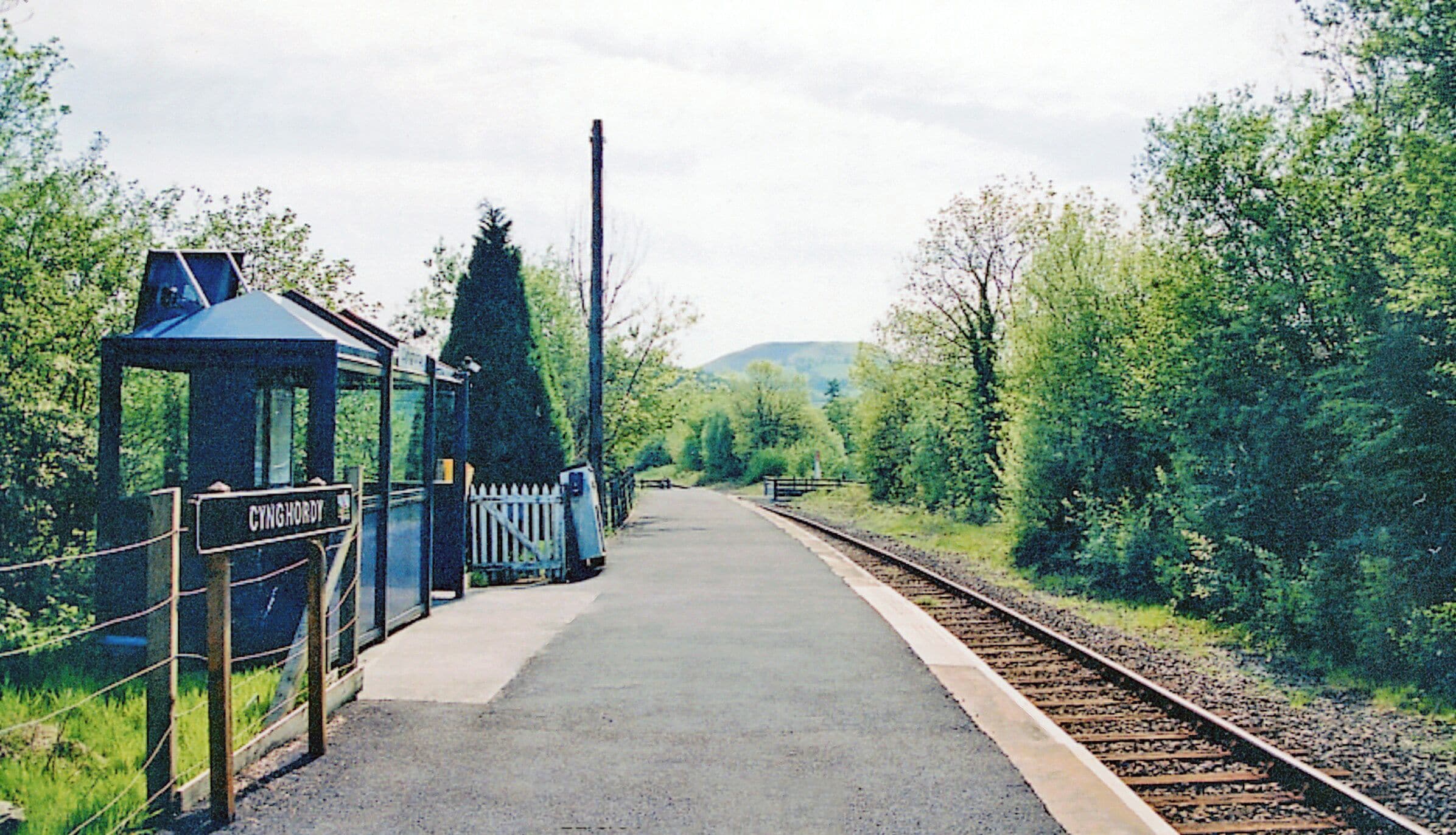 Cynghordy station, 2001 View SW, towards Llanelli and Swansea: ex-LNWR Central Wales line, Craven Arms, Llandrindod Wells, Builth Road, Llandovery, Llandilo, Pontardulais and Swansea line. Since 15/6/64, when also freight traffic ceased, trains have reached Swansea via Llanelli. The station (formerly a Halt, has been spruced up for the 'Heart of Wales' service.