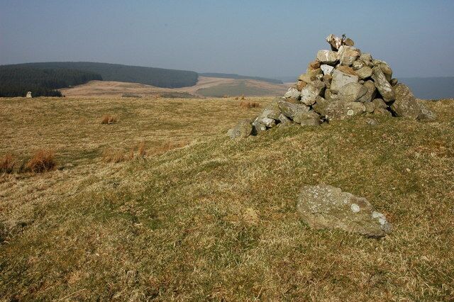 Cairn on upland above Rhandirmwyn This cairn along with a small standing stone, visible in the background are situated on high ground to the east of Rhandirmwyn.