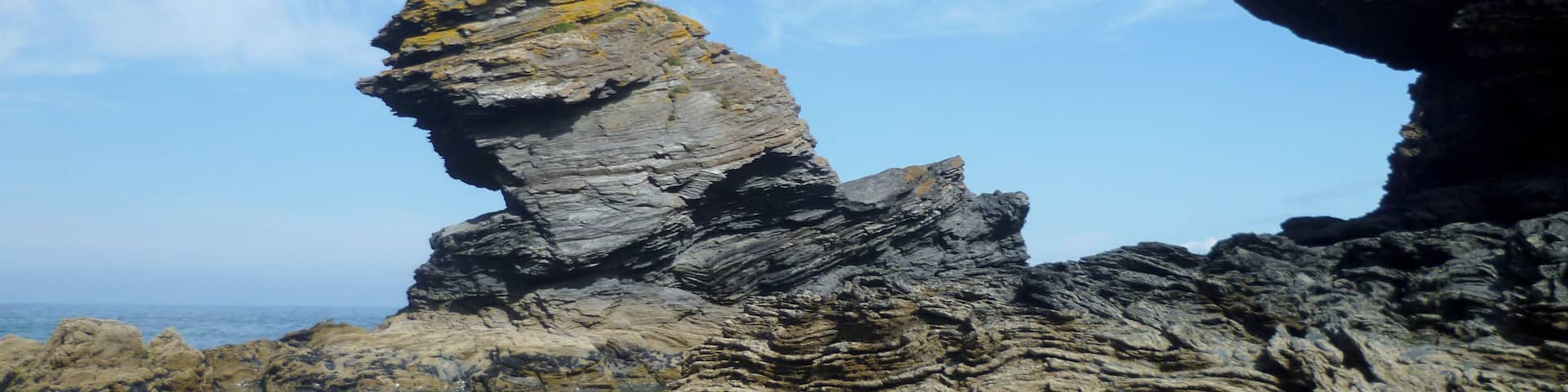 The Carreg Bica rock on the seashore in Llangrannog, Wales