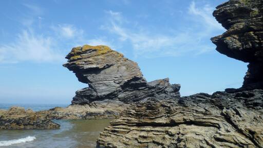 The Carreg Bica rock on the seashore in Llangrannog, Wales