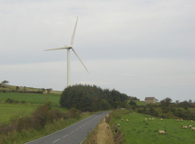 Wind Turbine, Moelfre, Llangeler One of three on this hill. What I assume to be the control building is on the right. Elegant and useful structure or eyesore? Notable that all three photographs for this square so far are of the turbines.