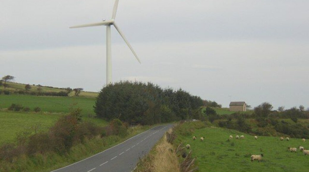 Wind Turbine, Moelfre, Llangeler One of three on this hill. What I assume to be the control building is on the right. Elegant and useful structure or eyesore? Notable that all three photographs for this square so far are of the turbines.