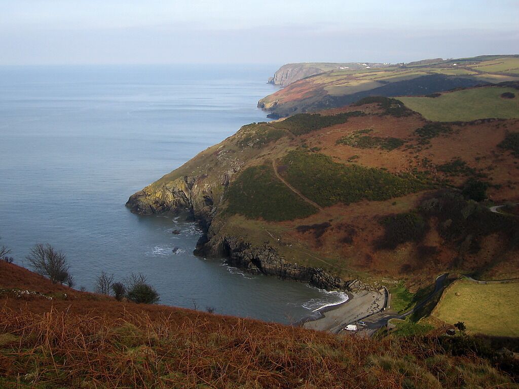 Cwmtydu Located at the mouth of the Afon Tydu, Cwmtydu is a small village with a tiny beach in a deep breach in the coastal cliffs. The Cerdigion Coast Path, from which this was taken, can be seen snaking back up the cliffside opposite. On this (south) side of Cwmtydu, the gradient would be too steep, and the long-distance path has been routed inland to reach the valley ground.