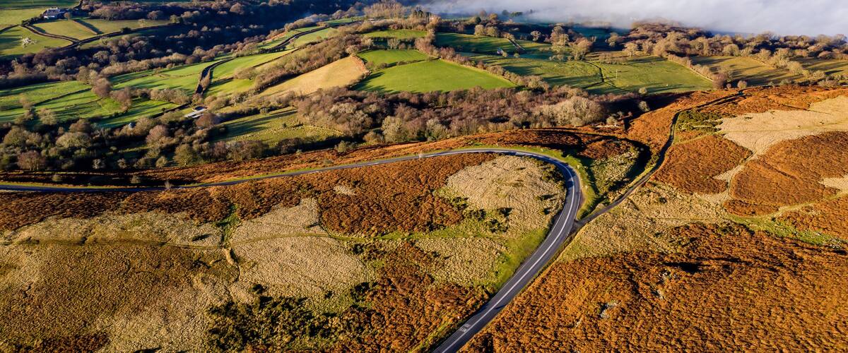 Aerial view of low level fog and cloud in a valley in the rural Brecon Beacons, Wales