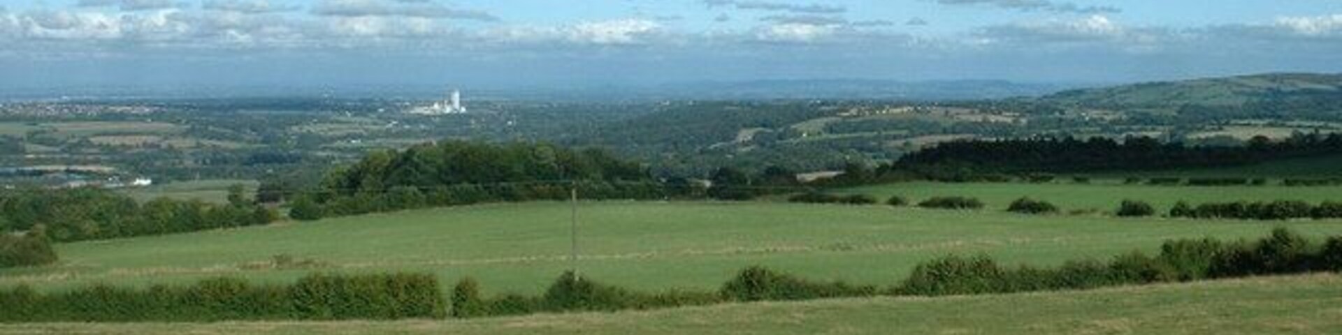 Farmland at Fron Uchaf. Looking east, with the cement factory at Buckley a prominent landmark in the distance.
