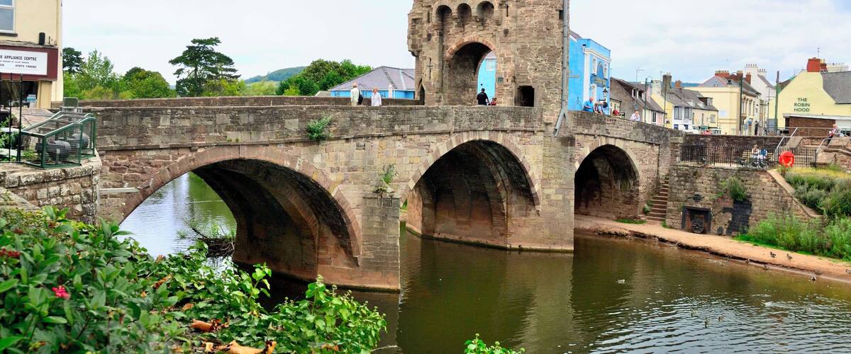 Monnow Bridge is a medieval bridge over the namesake river Monnow in the town of Monmouth, Wales. The existing bridge was completed in the late 13th century. It is the only remaining medieval fortified bridge in Britain.