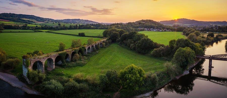 Monmouth Viaduct an old derelict railway viaduct bridge crossing the river Wye in Monmouthshire Wales.