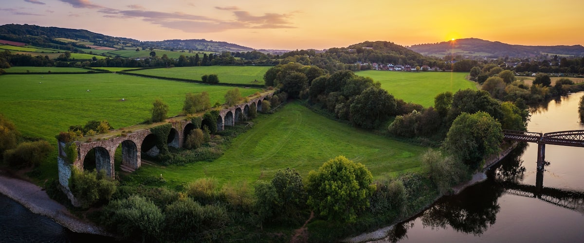 Monmouth Viaduct an old derelict railway viaduct bridge crossing the river Wye in Monmouthshire Wales.