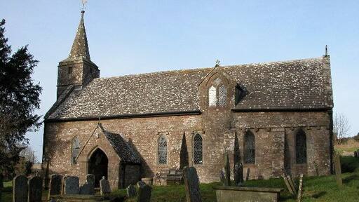 Welsh Newton church. Welsh Newton church is dedicated to St Mary the Virgin and is one of a few English churches with a saint buried in its graveyard, St. John Kemble. The village is on the England/Wales border, lying just in England.