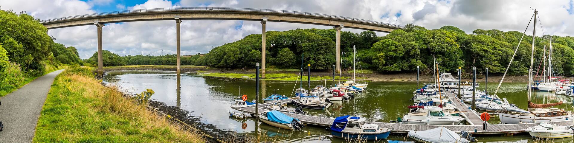 A panorama view of Westfield Pill showing boats moored and the road bridge at Neyland, Pembrokeshire, South Wales on a summers day