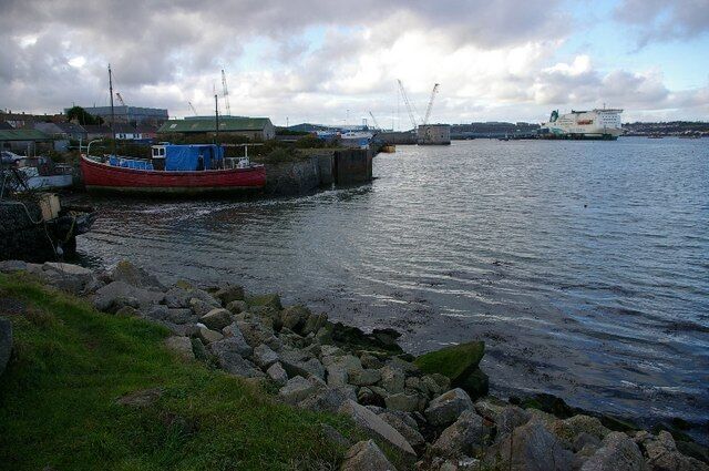 Pembroke Dock. View from the car park/picnic area. Ex-RAF Sunderland aircraft hangars to left, Martello tower in centre, and Pembroke-Rosslare ferry, "Isle of Innishmore" to the right. Pembroke Dock was initially a Royal Navy base. When it closed down, a RAF station was set up with Sunderland seaplanes.