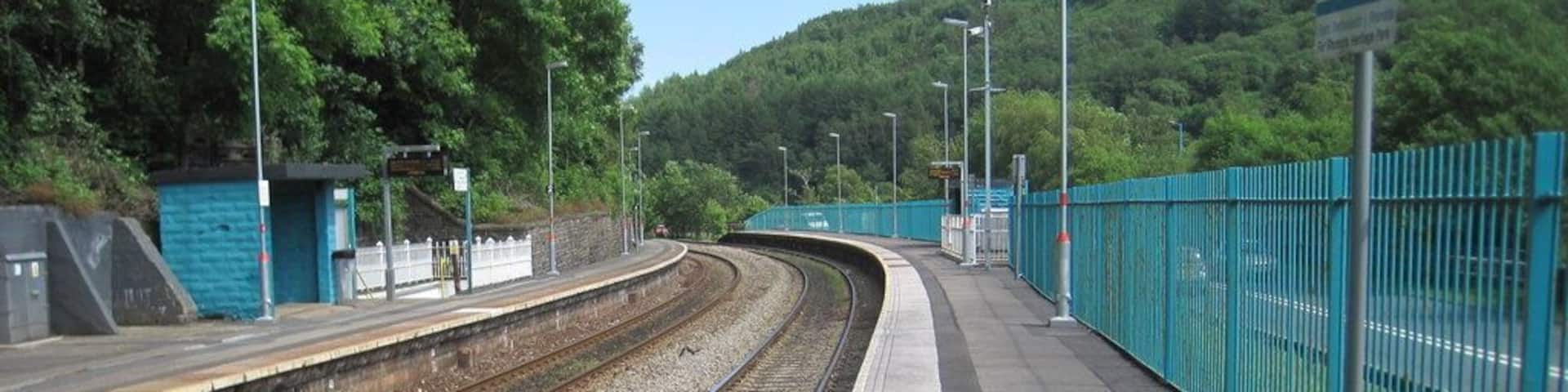 Trehafod railway station, Rhondda Cynon Taf. Opened in 1861 by the Taff Vale Railway on what is now the line from Cardiff to Treherbert. View south east towards Pontypridd and Cardiff. This was formerly the junction station for the Barry Railway, which diverged to the right around 350m beyond the ends of the platforms.