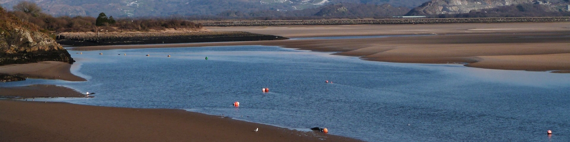 Afon Dwyryd that is joined by Afon Glaslyn from the left. Looking up to Moel Ddu in the background. The landscape is all within Snowdonia National Park, the oldest national park in the world.