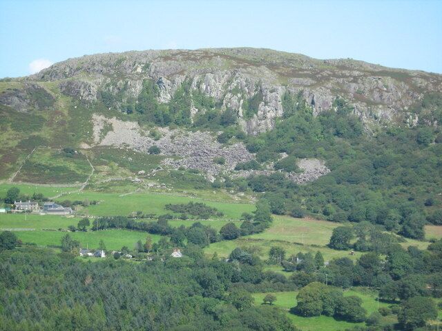 Craig y Gesail Seen from a distance [near Cefn Cyfanedd]. Tyddyn Deucwm Isaf farm is visible centre left.