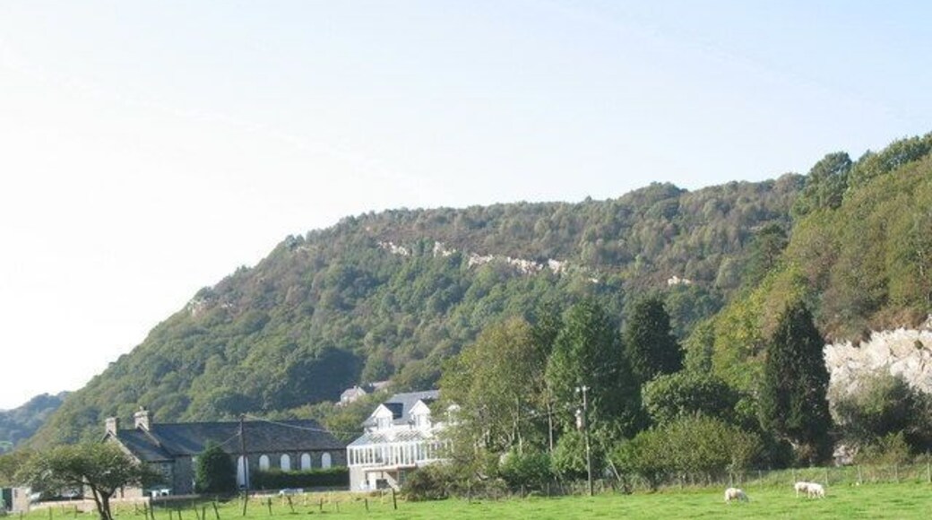 A view across Prenteg towards Pen y Garn Hill The tilted rocky scar on Pen y Garn is a noticeable feature.