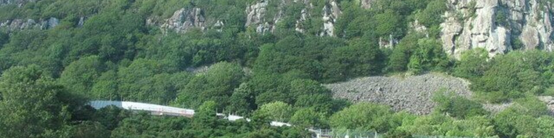 Craig Alltwen towering above the new hospital of the same name