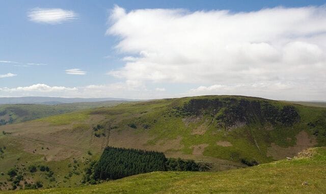 Summit of Garreg Lwyd Looking SW from the grassy summit across the Wye Valley to Moelfryn.