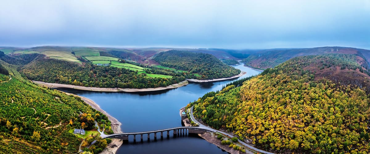 Autumn over Garreg Ddu Dam from a drone, Elan Valley, Caban-Coch Reservoir, Rhayader, Wales, UK