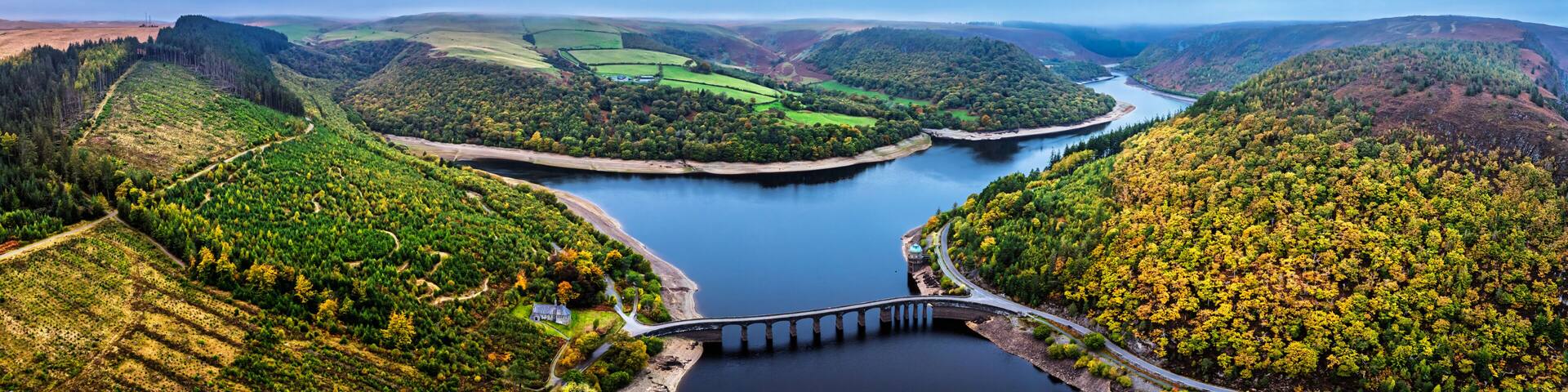 Autumn over Garreg Ddu Dam from a drone, Elan Valley, Caban-Coch Reservoir, Rhayader, Wales, UK