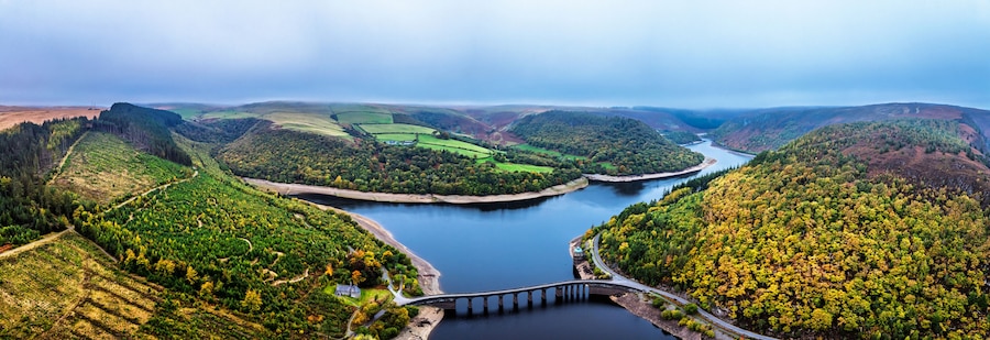 Autumn over Garreg Ddu Dam from a drone, Elan Valley, Caban-Coch Reservoir, Rhayader, Wales, UK