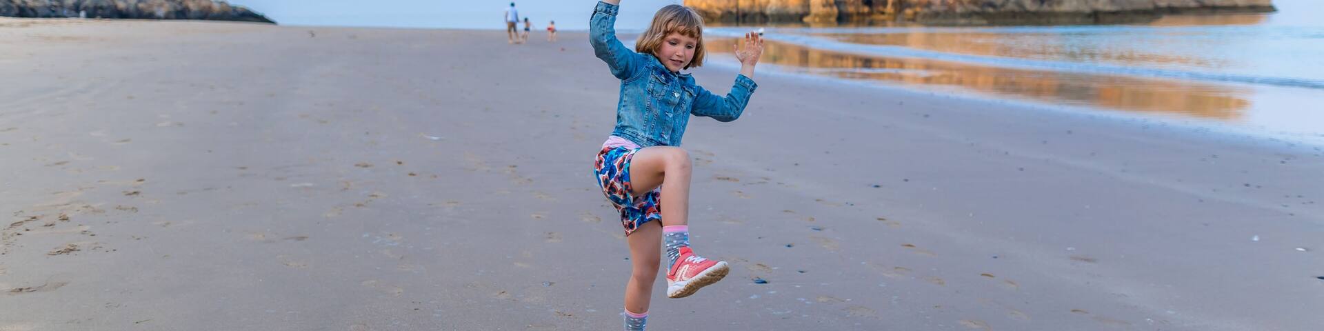 Girl at the seaside after sunset, Wales