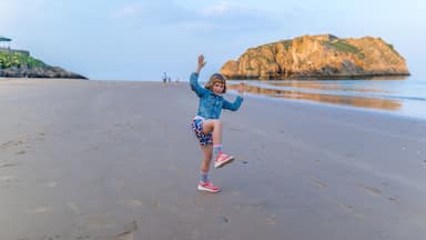 Girl at the seaside after sunset, Wales