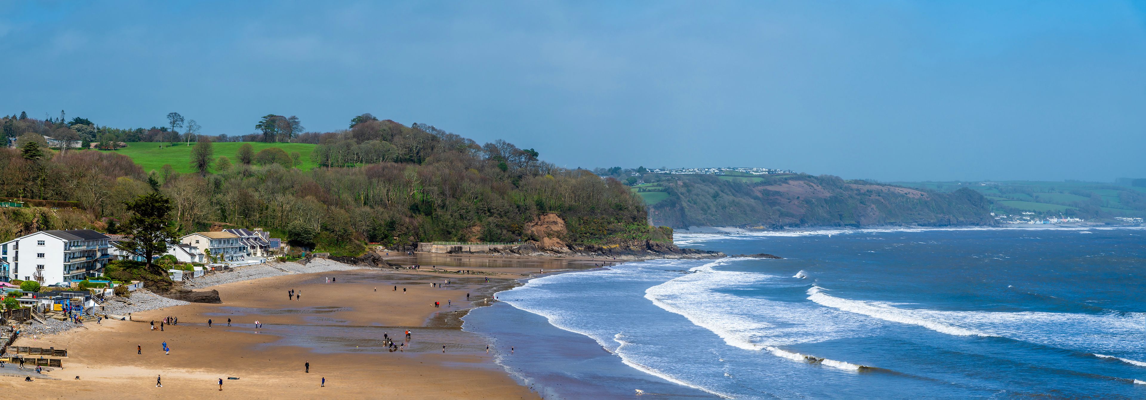 A panorama view over the beach at low tide in Saundersfoot, Wales on a bright spring day