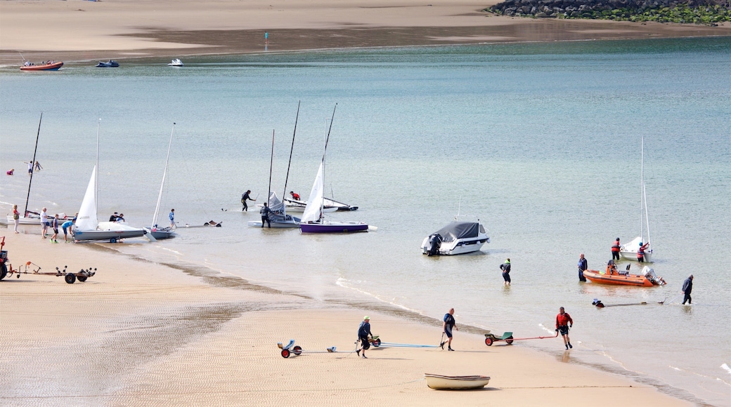 Tenby featuring a bay or harbor, boating and a beach