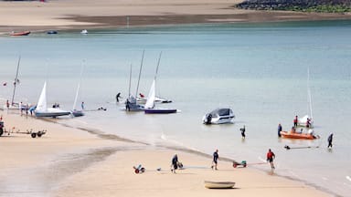 Tenby featuring a bay or harbor, boating and a beach