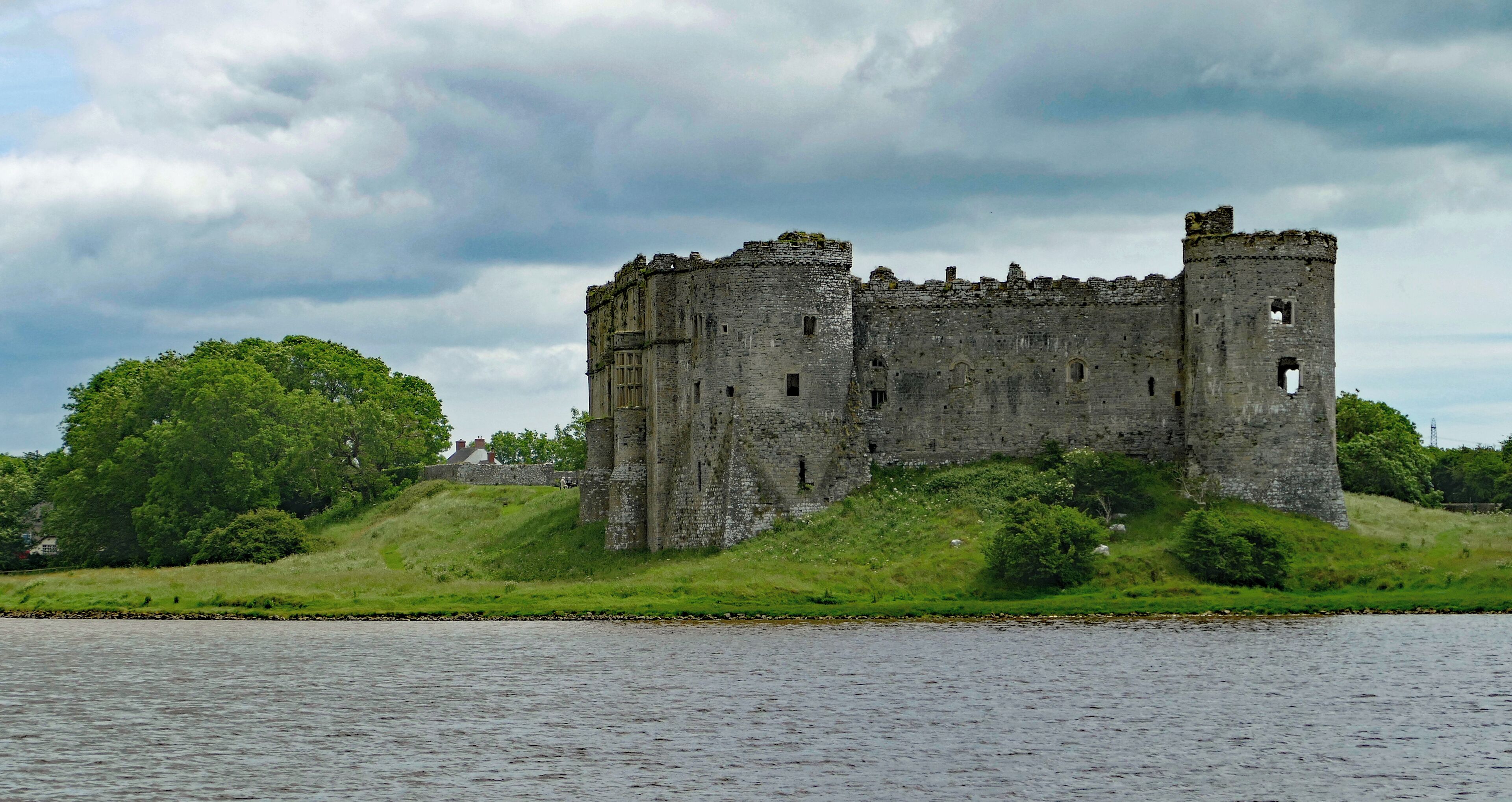 Looking magnificent across the flooded mill pond of Carew Mill. Fortification here dates from the Norman incursions into Wales in about 1100 but the structure seen today dates from the late thirteenth century and the third generation of "Carews".