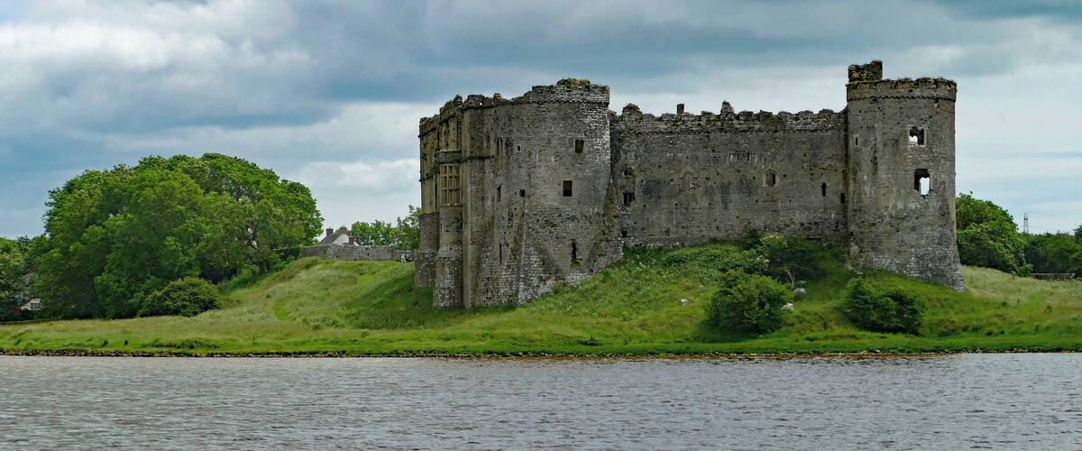 Looking magnificent across the flooded mill pond of Carew Mill. Fortification here dates from the Norman incursions into Wales in about 1100 but the structure seen today dates from the late thirteenth century and the third generation of "Carews".