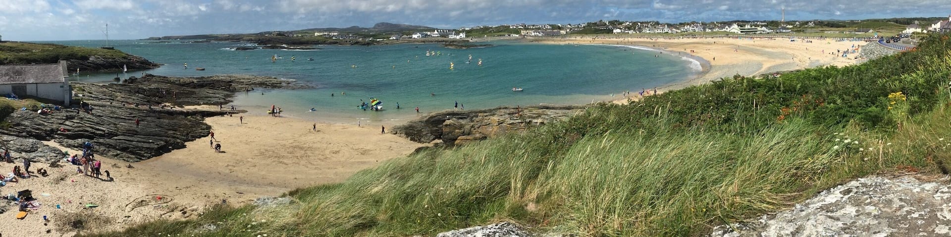 Trearddur or Trearddur Bay is a community, village and seaside resort south of Holyhead on the west coast of Holy Island off the north-west coast of Anglesey in Wales.