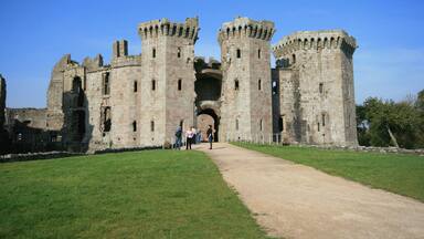 A historic castle with two prominent towers and a central archway.