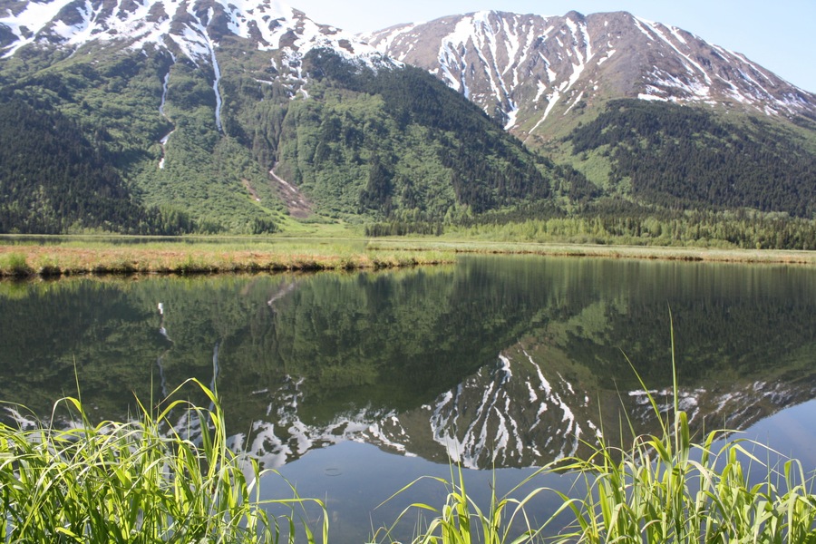 Mountains reflecting on the water...the perfectly still air made for a nice glass-like photo.