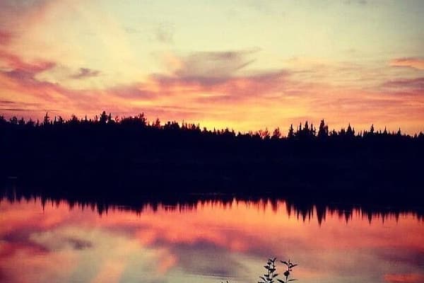 Evening autumn sunset reflection on lake in interior Alaska #Adventure