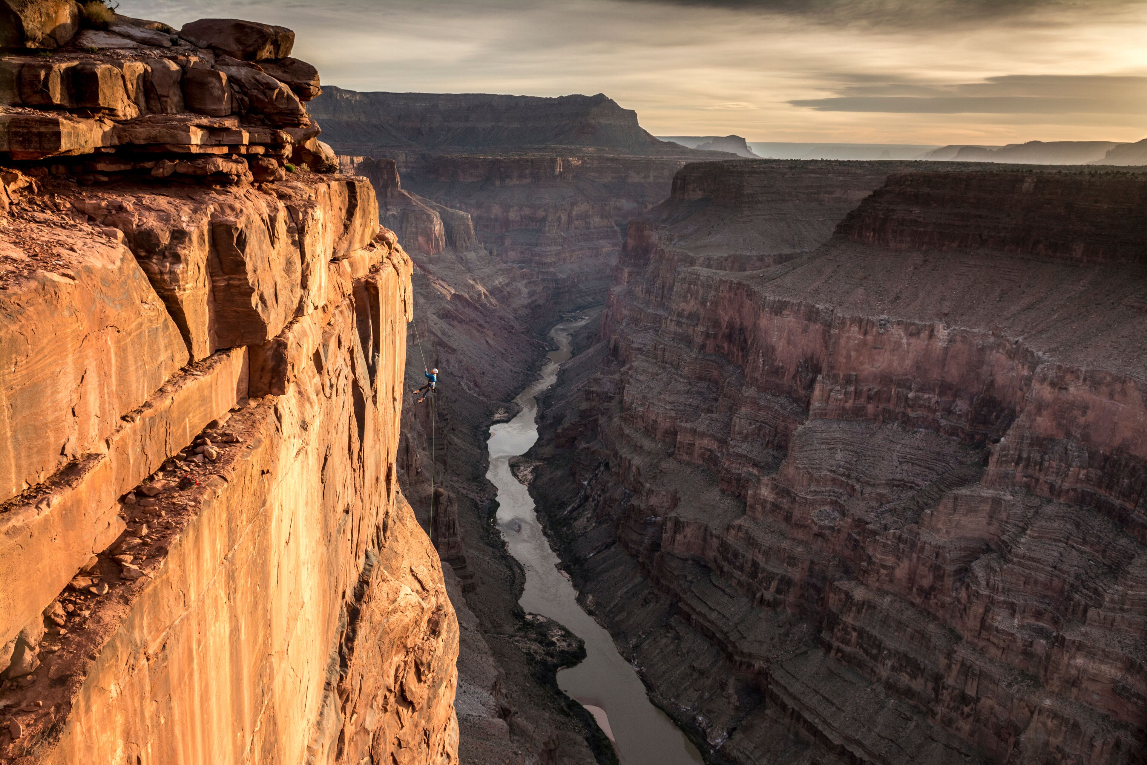 A woman rappelling off Toroweap Overlook, Grand Canyon National Park, Fredonia, Arizona.