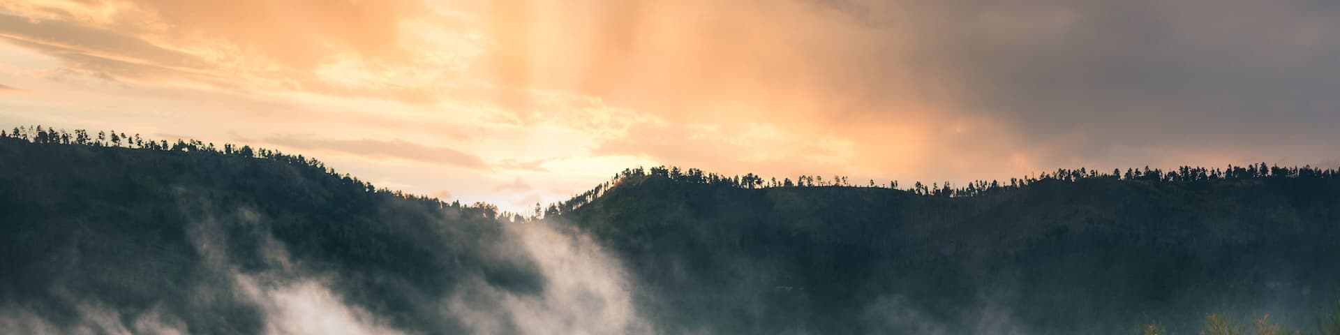 River Reservoir - Greer Arizona during the morning golden hour fog over lake