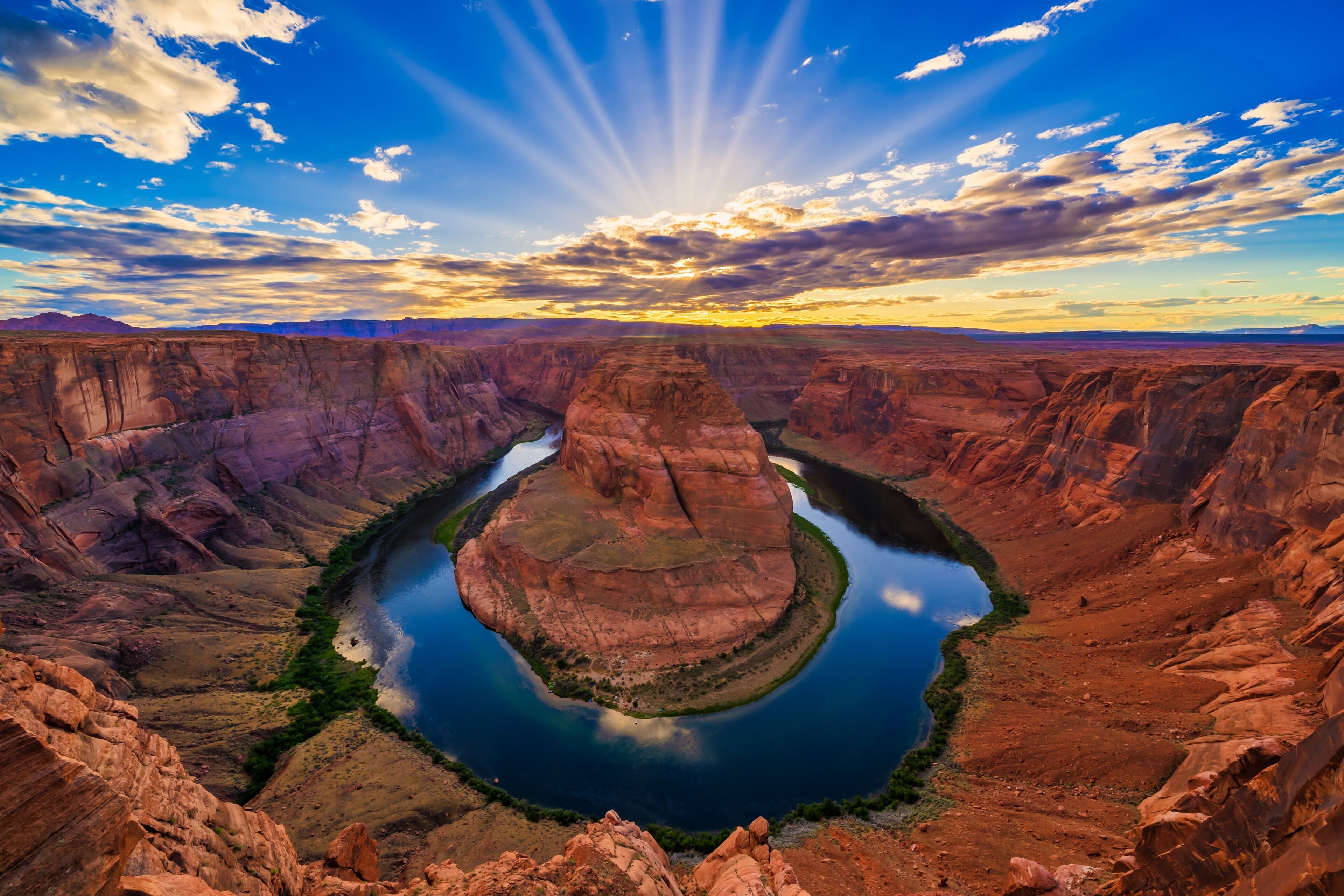 A canyon with a river winding through it.